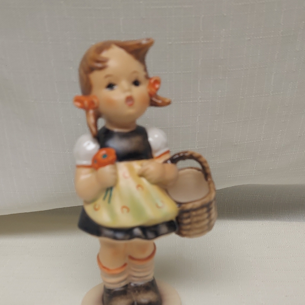 Goebel M.I. Hummel figurine titled "Sister" (Hummel #98)